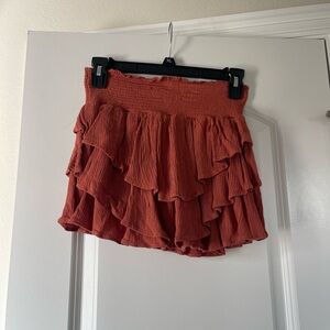 Super cute burnt orange skirt with built in shorts size small
